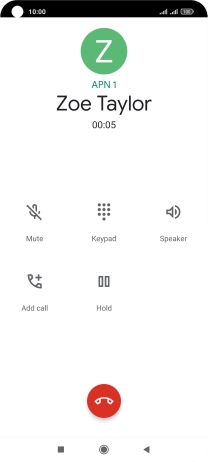 Press the end call icon.