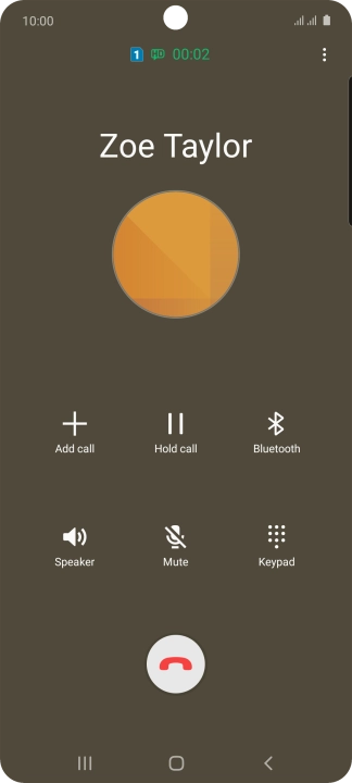 Press the end call icon.