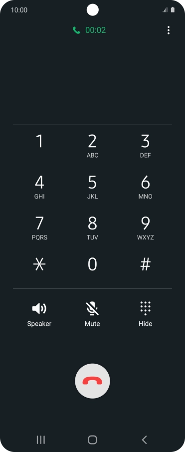 Press the end call icon.