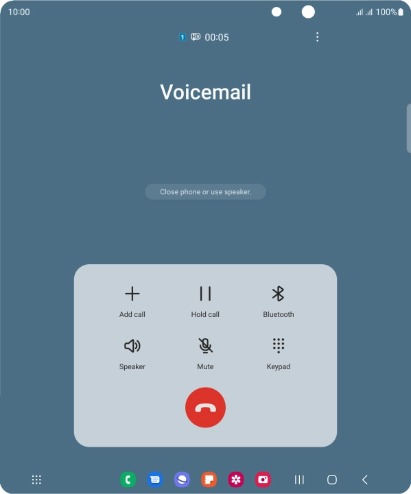 Press the end call icon.
