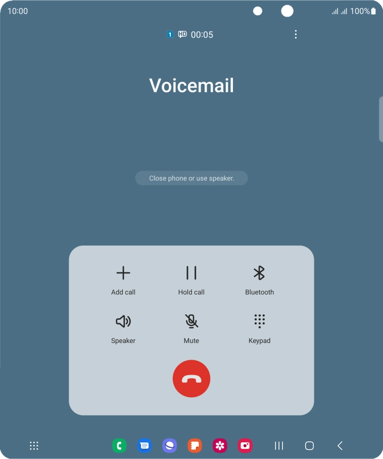 Press the end call icon.