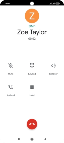Press the end call icon.