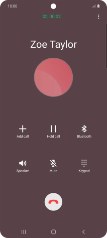 Press the end call icon.