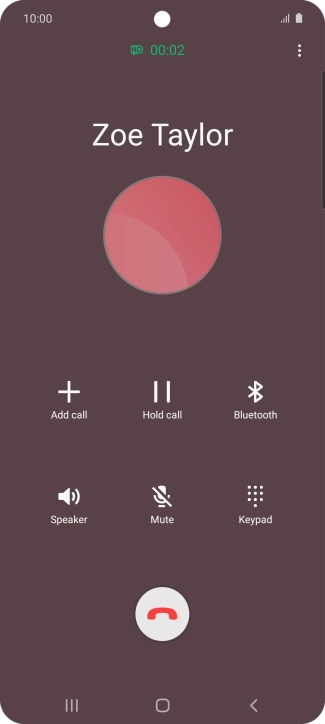 Press the end call icon.