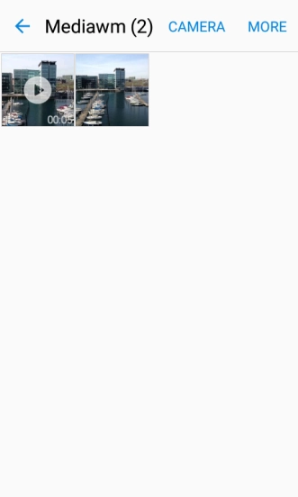 Go to the required folder and press the required picture or video clip.