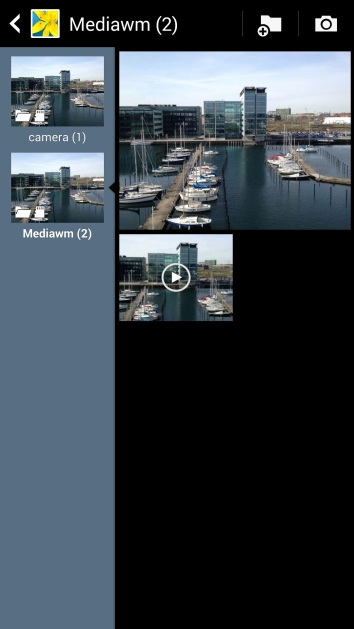 Go to the required folder and press the required picture or video clip.