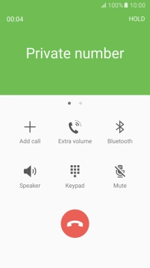 Press the end call icon.
