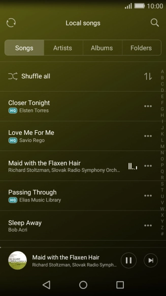 Press the album cover at the bottom of the screen.
