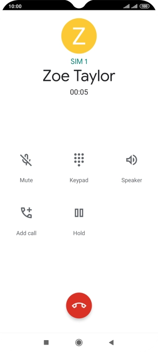 Press the end call icon.