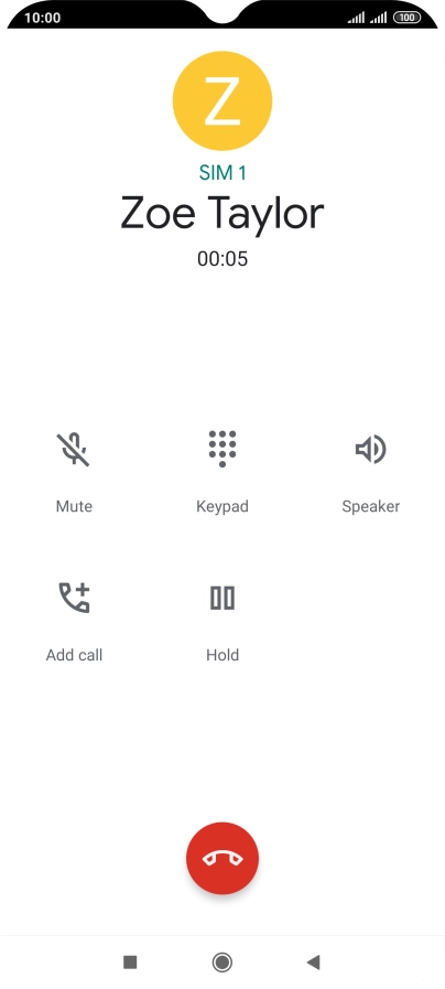 Press the end call icon.
