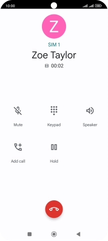 Press the end call icon.