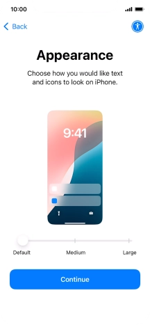 Select the required text and icon size on your phone and press Continue.