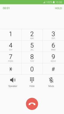Press the end call icon.