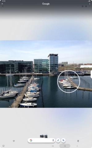 Draw a circle around the required object on the picture and wait for the search results.