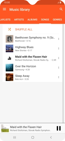 Press the song title at the bottom of the screen.