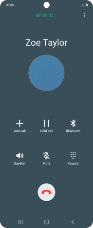 Press the end call icon.