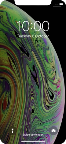 Slide your finger upwards starting from the bottom of the screen.