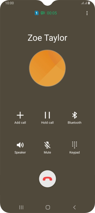 Press the end call icon.