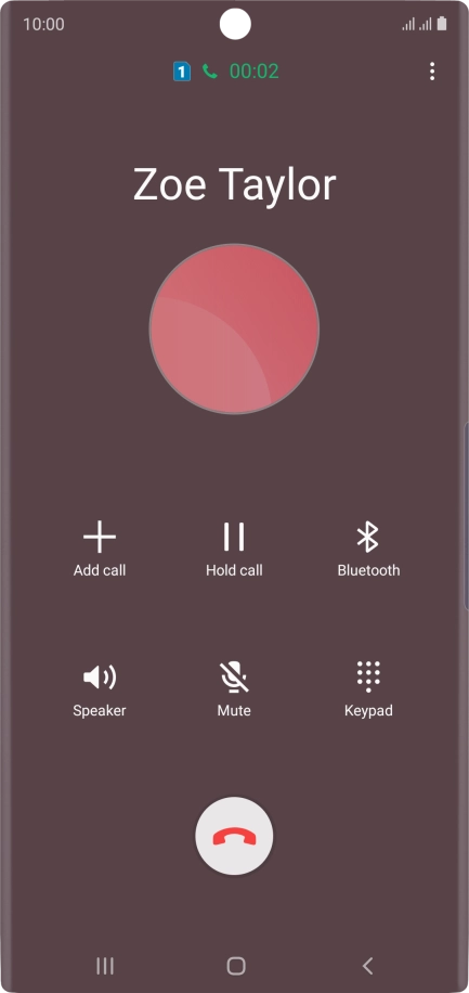 Press the end call icon.