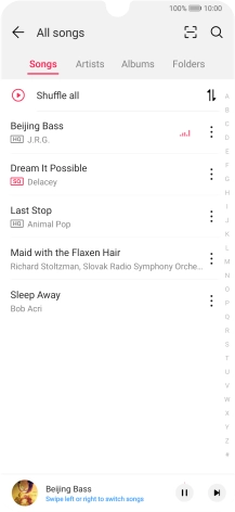 Press the song title at the bottom of the screen.