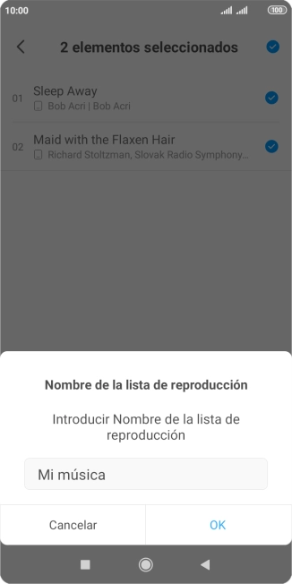 Introduce el nombre deseado de la lista de reproducción y pulsa OK.
