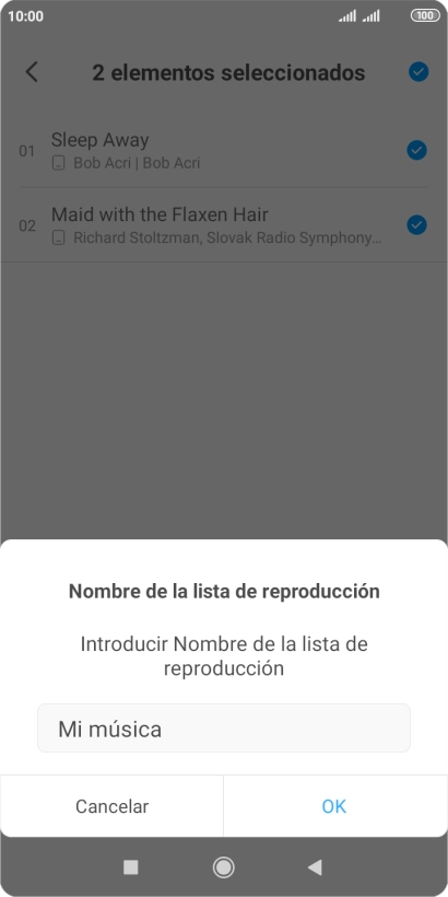 Introduce el nombre deseado de la lista de reproducción y pulsa OK.