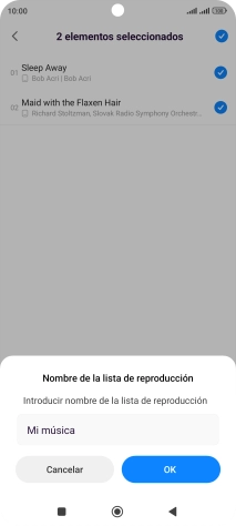 Introduce el nombre deseado de la lista de reproducción y pulsa OK.