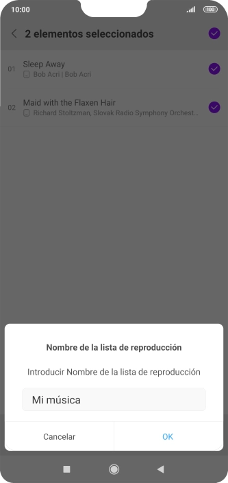 Introduce el nombre deseado de la lista de reproducción y pulsa OK.