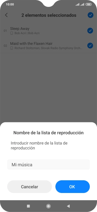 Introduce el nombre deseado de la lista de reproducción y pulsa OK.