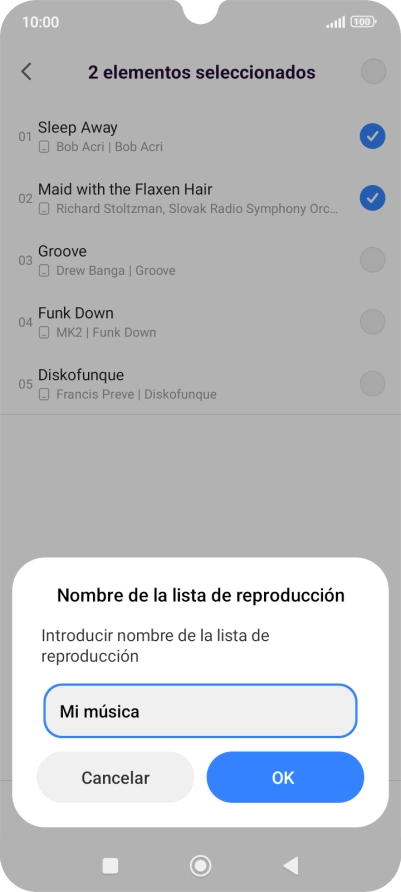 Introduce el nombre deseado de la lista de reproducción y pulsa OK.