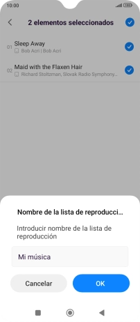 Introduce el nombre deseado de la lista de reproducción y pulsa OK.