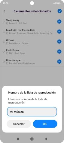 Introduce el nombre deseado de la lista de reproducción y pulsa OK.