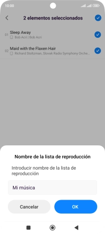 Introduce el nombre deseado de la lista de reproducción y pulsa OK.