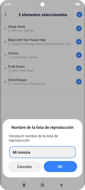 Introduce el nombre deseado de la lista de reproducción y pulsa OK.