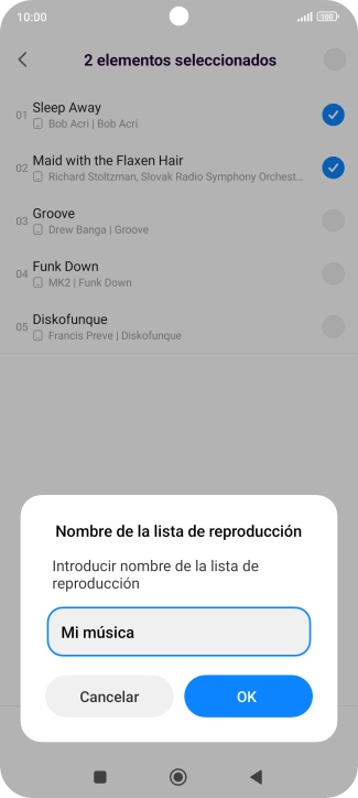 Introduce el nombre deseado de la lista de reproducción y pulsa OK.