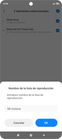 Introduce el nombre deseado de la lista de reproducción y pulsa OK.