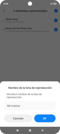 Introduce el nombre deseado de la lista de reproducción y pulsa OK.