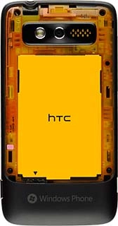 Take hold of the the top of the battery and remove it.