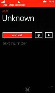 Make sure the call you want to end is active.Press end call.The active call is ended and the call on hold is automatically activated.