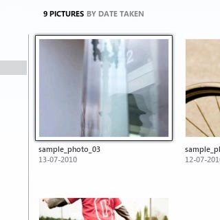 Highlight the required picture or the required video clip and drag it to the computer icon in the bottom left corner of the screen.