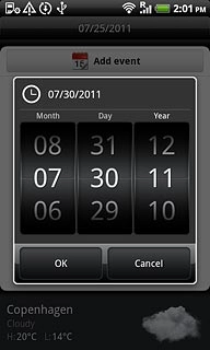 Slide the numbers up or down to select the date.