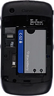 Take hold of the top of the battery and remove it.