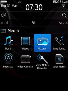 Press Pictures or Videos.Go to the required folder.
