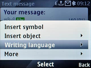 Scroll to Writing language and press the Navigation key.
