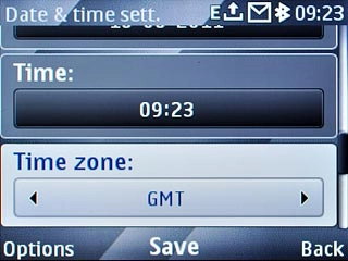 Scroll to Time zone and press Navigation key right to select the required time zone.