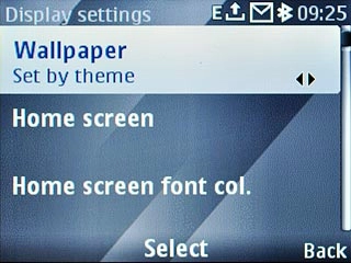 Scroll to Wallpaper and press the Navigation key.