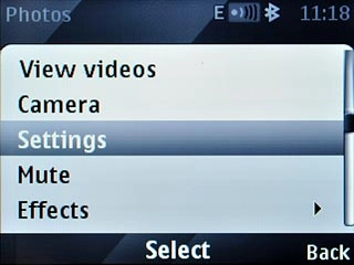 Scroll to Settings and press the Navigation key.