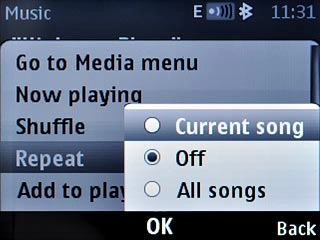 Highlight Current song, Off or All songs and press the Navigation key.