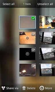 When a picture or video clip is ticked (V), it's selected.