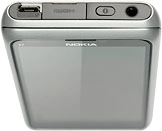 Connect the charger or data cable to the phone socket and to a wall socket or your computer's USB port.